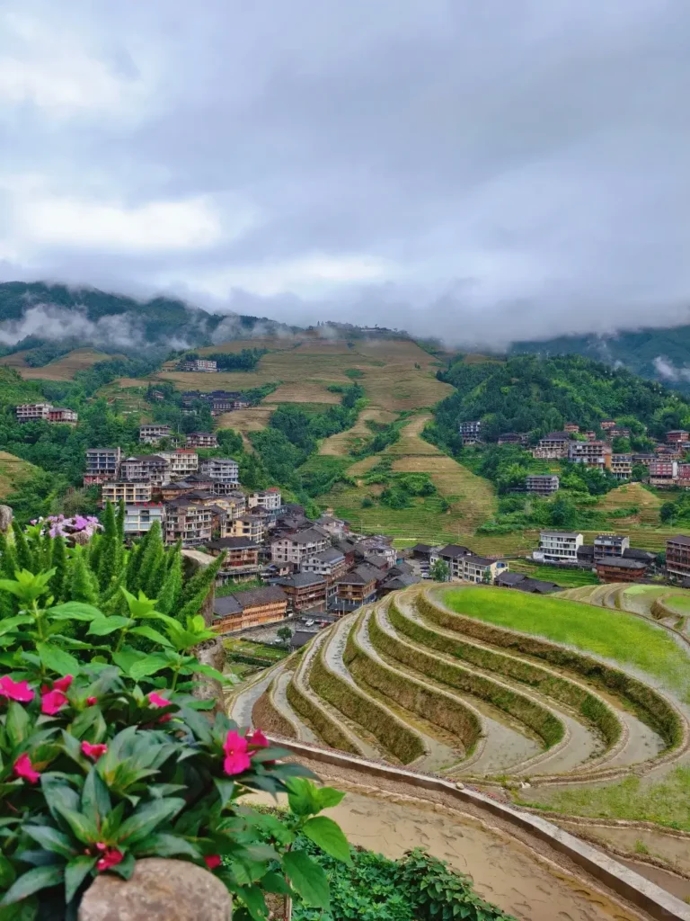 Guangxi travel guide
Guangxi itinerary
China travel
The Red Yao and Jinkeng Hike
Experiencing a tranquil bamboo raft ride during your comprehensive Guangxi itinerary adventure.