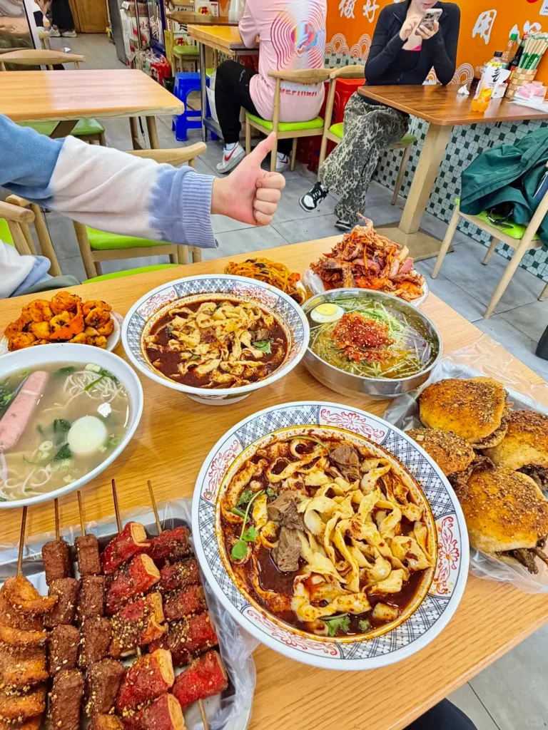 A massive, refreshing bowl of Jixi Cold Noodles surrounded by vibrant, spicy Ban Cai side dishes, the absolute best culinary experience in your Jixi itinerary.
Jixi travel guide
Things to do in Jixi
Jixi itinerary
Xingkai Lake
Hutou Fortress
Jixi Cold Noodles